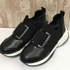 タ　エンチャテッド　スニーカーブーツ 晴雨兼用ウェッジヒールメタルバックルスニーカー