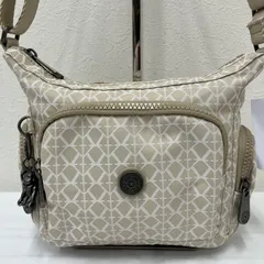 9322　KIPLING　Kipling　キプリング　ショルダーバッグ　GABBIE　Signature Beige　肩がけ　斜めがけ　クロスボディ　ベージュ　ライトベージュ　総柄　レディース　モンキーチャーム　チャーム　ロボットモンキー　ゴリラ　サル