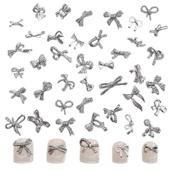 ネイルパーツ リボン 100個セット 3D立体 蝶結び 蝶々 メタルパーツ シルバー ジュエリーパーツ ハンドメイド ネイルアート デコパーツ DIY ランダム形 (A)