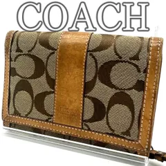 コーチ COACH 二つ折り財布 ウォレット シグネチャー キャンバス　レザー ベージュ ブラウン コンパクト ミディアムサイズ ホック開閉 札入れ複数 カードスロット多数 L字ファスナー小銭入れ 背面ポケット付き ヴィンテージ デイリー 通勤 通学