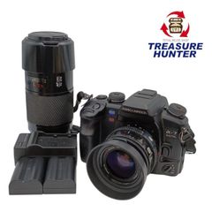 Used KONICA MINOLTA α-7 DIGITAL digital SLR camera with two MINOLTA AF ZOOM lenses: 35-70mm 1:4 (22mm) and 70-210mm 1:4 (32mm), black [Product Code: 103047261002]
