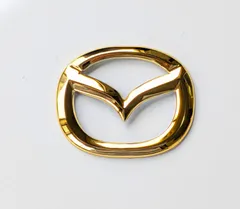 新品 未使用 マツダ ステアリングエンブレムステッカー ゴールドのサムネイル