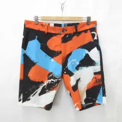 デサント DESCENTE GOLF ゴルフ スポーツウエア パンツ ショートパンツ ハーフ 総柄 速乾 黒 オレンジ 青 ブラック ブルー 85/O 