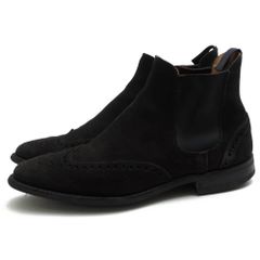 Crockett & Jones side-gore boots for men. These boots feature a suede leather construction in dark brown, with a Newbury City sole, wingtip design, and Goodyear welt construction.