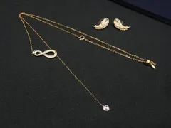 ■美品■ SWAROVSKI スワロフスキー Nice インフィニティ 2点セット まとめ売り ネックレス ピアス アクセサリー ゴールド系 BP7818
