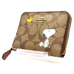 【遊び心に品を添えて】　COACH × PEANUTS　二つ折り財布 シグネチャー ラウンドファスナー スヌーピー コンパクトウォレット　ブラウン