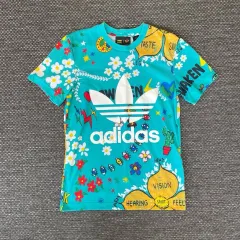 adidas(アディダス) X ファレル ウィリアムズ 緑 ビックロゴ 半袖 Tシャツ 90