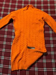 オレンジ色 ケーブル編み セーター