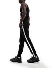 フレッドペリー メンズ ボトムス カジュアルパンツ パンツ スウェットパンツ Fred Perry taped track sweatpants Black ブラックのサムネイル