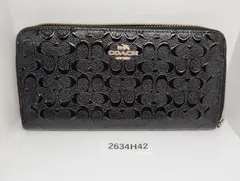 【2634H42】 コーチ COACH  ラウンドファスナー エナメルエンボス　黒　シグネチャー