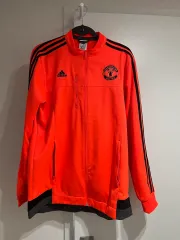 アディダス MANCHESTER UNITED FC(マンチェスター・ユナイテッドFC) トラックジャージ オレンジ