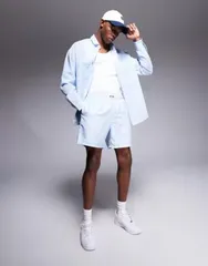 エイソス メンズ 水着 ハーフパンツ・ショーツ ショートパンツ ASOS DESIGN swim shorts in mid length and blue stripe with badge detail part of a set BLUE ブルー