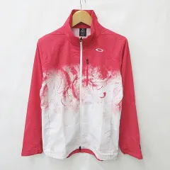 オークリースカルコレクション OAKLEY SKULL COLLECTION ジャケット ウインドブレーカ ゴルフ スポーツウェア 長袖 ジップアップ メッシュ 総柄 ピンク 白 ホワイト L