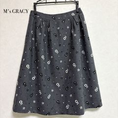 エムズグレイシー 2024春夏新作 フレアスカート 花リボンロゴ ベージュ