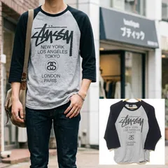 人気ブランド【STUSSY】ステューシー ワールドツアー ラグラン 7分袖 Tシャツ カットソー ロンT クルーネック コットン100% 綿 グレー 灰色 ブラック 黒 ストリート スケーター サーフ メンズ サイズS /M44364jQ