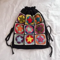 【ハンドメイド・完成品】ナップサック　メッシュ　星　リバーシブル　黒　バッグ　リュック　編み物　メンズ　レディース　ユニセックス　1点もの　限定　１点物　内布付き　教科書・PCも入ります◎