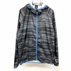 【中古】[印象AB] TIGORA ティゴラ パーカー / ジャケット メンズ M グレー系×ブルー ポリ100% 背中にベンチレーションスリット ハイネックフード ロゴプリント ラグランスリーブ 薄手 ジップアップ 裏地無し タイガーカモ風の総柄 長袖のサムネイル