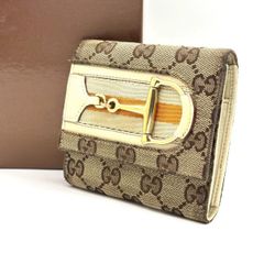 余韻を閉じ込める】 GUCCI 二つ折り財布 GGスプリーム がま口 グッチ