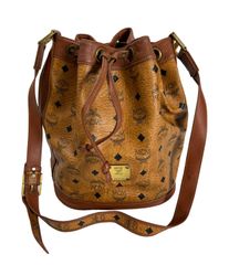 MCM ロゴプリント ブラウンレザーショルダーバッグ 巾着型 鍵付き