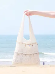 バッグ レディース トートバッグ この夏のカジュアルバケーション レディース かぎ編み 編み込み ビーチトートバッグは、中空デザインが特徴で、大容量 折りたたみ式 巾着バケツバッグ。ビーチ旅行やロマンチックな休暇に