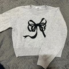 Darich 完売品 ニットボレロリボンベアトップス WHT - メルカリ
