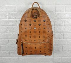 MCM リュック エンボス入り チョコレートブラウン - メルカリ