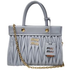 MIUMIU ミュウミュウ 花柄 フラミンゴ セットアップ 短袖シャツ 38サイズ スカート 40サイズ 【中古】 12604K172 MIU MIU - MIUMIU ミュウミュウ 花柄 フラミンゴ セットアップ 短袖
