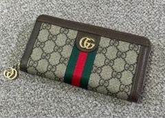 GUCCI GGキャンバス 二つ折り財布 タッセル付き - メルカリ