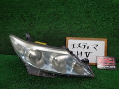 エスティマ AHR20W 左ヘッドランプ・ヘッドライト G コイト 28-212