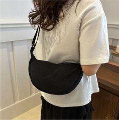 Brand new, ultra-lightweight, water-resistant mini crossbody bag (unisex).