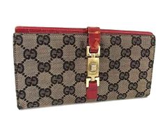 グッチ GUCCI GGキャンバス 二つ折り財布 ブーツチャーム付き - メルカリ