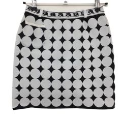 Archivio knit skirt, white x black polka dot, stretch, slight staining on pocket openings and front, minor pilling, women's golf wear.