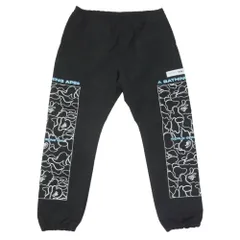 A BATHING APE アベイシングエイプ 001PTH801011M Rip Stop Track Pants サイドプリント リップストック トラックパンツ ブラック系 L【中古】のサムネイル
