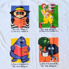 【 McDonald's ( マクドナルド )】『 this book〜 』Tシャツ / ロナルド・マクドナルド / ハンバーグラー / グリマス / フライキッズ 〚アメリカン雑貨 アメトイ〛のサムネイル
