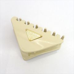 PRADA ヘアクリップ アイボリー ホワイト - メルカリ
