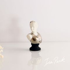 Artwork: Venus de Milo bust fève (museum fève), French-made miniature ceramic figurine.
