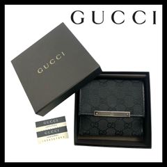 GUCCI グッチ GGエンボス 長財布 ダークブラウンノベルティー - メルカリ