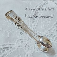 British antique silver-plated sugar tongs.