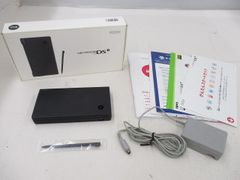 Used Nintendo DS console (DSi TWL-001, black), working condition, includes box, manual, and peripherals.