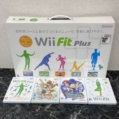 24. Wii Fit Plus with software, includes 4 software titles. *Damaged.