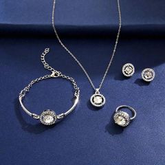 Ladies' Jewelry Set: 5-piece set including necklace, earrings, ring, and bracelet. Silver-colored with rhinestones. Luxurious jewelry perfect for weddings, parties, and everyday wear.