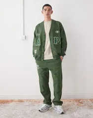 ベイシング エイプ メンズ ボトムス カジュアルパンツ スウェットパンツ Aape by A Bathing Ape loose fit sweatpants in dark green camo Mのサムネイル