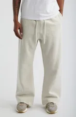 フィアオブゴッド メンズ ボトムス カジュアルパンツ スウェットパンツ Fear of God Essentialsignature Flare Sweatpants ConcreteDark Conのサムネイル