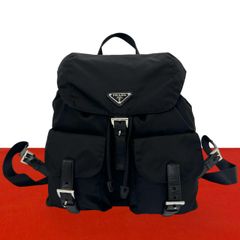 Excellent condition PRADA backpack/daypack in black with triangular logo hardware, made of Tessuto nylon and genuine leather. (0016a)