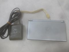 Nintendo DS Lite console (USG-001), working condition, gloss silver, with peripherals, used.