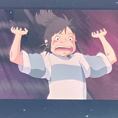 Film reel of "Spirited Away" by Studio Ghibli, 35mm, featuring "Chihiro running down the stairs," clear block, framed, released in 2001, by Hayao Miyazaki (FLM003)