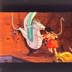 Film reel of "Spirited Away" by Studio Ghibli, 35mm, "Chihiro and Haku the Dragon," released in 2001, framed, clear block, Hayao Miyazaki (FLM041)