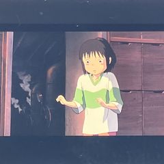 Film reel of "Spirited Away" (35mm), Studio Ghibli, "Chihiro Standing at the Doorway," framed clear block, directed by Hayao Miyazaki, released in 2001 (FLM035)