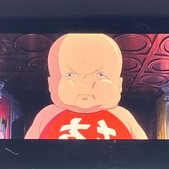 Film reel of "Spirited Away" (35mm), Studio Ghibli, "The Crying Boy," directed by Hayao Miyazaki, released in 2001, framed, clear block (FLM019)