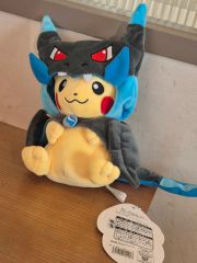 メガリザードンXのポンチョを着たピカチュウ タグ付き - メルカリ